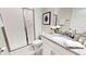 Bright bathroom featuring a glass-enclosed shower, granite countertop, and modern fixtures at 3083 Tom Sawyer Dr, Kissimmee, FL 34746