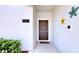 Close-up of the front door with floral decorations and address number 3083 at 3083 Tom Sawyer Dr, Kissimmee, FL 34746