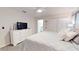 Neutral main bedroom with a ceiling fan, dresser, and relaxing decor at 3083 Tom Sawyer Dr, Kissimmee, FL 34746