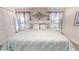 Comfortable main bedroom with neutral decor, large bed, and decorative wall art at 3083 Tom Sawyer Dr, Kissimmee, FL 34746