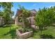 Beautiful backyard with a built-in grill, pergola, and lush landscaping at 3188 Verbena Ct, Deltona, FL 32725