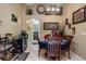 Cozy dining area adjacent to the kitchen, featuring elegant decor and a modern wine refrigerator at 3188 Verbena Ct, Deltona, FL 32725