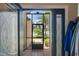 A clear view through the glass front door and screen door into the manicured front yard at 3188 Verbena Ct, Deltona, FL 32725