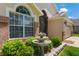 Charming exterior view with a beautiful fountain, well-manicured shrubs, and manicured lawn at 3188 Verbena Ct, Deltona, FL 32725