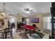 Stylish game room with a red pool table, bar area, and a wall-mounted television, perfect for relaxation at 3188 Verbena Ct, Deltona, FL 32725