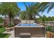 Relaxing hot tub surrounded by tropical landscaping in a private backyard setting at 3188 Verbena Ct, Deltona, FL 32725