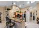 Bright kitchen with granite countertops, stainless steel appliances, and pendant lighting over the breakfast bar at 3188 Verbena Ct, Deltona, FL 32725