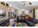 Expansive living area showcasing a stylish blue sectional and view to the entryway at 3188 Verbena Ct, Deltona, FL 32725