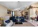 Bright and spacious living room with large sectional sofa and adjacent to the entryway at 3188 Verbena Ct, Deltona, FL 32725