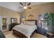 Serene primary bedroom with a vaulted ceiling, plush bedding, ample natural light, and private patio access at 3188 Verbena Ct, Deltona, FL 32725