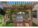 Built-in outdoor grill with a stone base and stainless steel grill, perfect for entertaining at 3188 Verbena Ct, Deltona, FL 32725