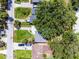 Aerial view of property with well-manicured lawn on a tree-lined street at 3474 Fairway Ln, Orlando, FL 32804