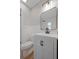 Bathroom with white subway tile in shower, white vanity, and black hardware at 3474 Fairway Ln, Orlando, FL 32804