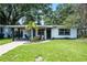 Charming single-story home with a well-manicured lawn and inviting curb appeal at 3474 Fairway Ln, Orlando, FL 32804