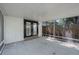 Covered screened-in patio with access to the backyard, featuring a concrete floor at 3474 Fairway Ln, Orlando, FL 32804
