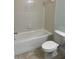 Bathroom features a tub, tile surround, and a toilet for essential functionality at 3530 Rodrick Cir, Orlando, FL 32824