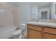 Bathroom with tiled shower-tub combo, single vanity with granite top and toilet at 3530 Rodrick Cir, Orlando, FL 32824