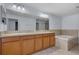 Spacious bathroom features a double vanity, soaking tub and large mirror at 3530 Rodrick Cir, Orlando, FL 32824