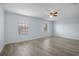 A bedroom features neutral walls, window blinds and wood-look floors at 3530 Rodrick Cir, Orlando, FL 32824