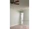 Bedroom with wood-look floors, ceiling fan, and interior door visible at 3530 Rodrick Cir, Orlando, FL 32824