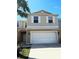 Charming townhouse with two-car garage and neutral color palette at 3530 Rodrick Cir, Orlando, FL 32824