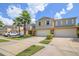 Charming townhomes with well-manicured lawns and attached garages under a sunny sky at 3530 Rodrick Cir, Orlando, FL 32824