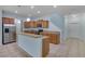 Modern kitchen with ample counter space, stainless steel appliances, and a breakfast bar at 3530 Rodrick Cir, Orlando, FL 32824