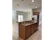 Kitchen area features an island, granite counters and stainless steel appliances at 3530 Rodrick Cir, Orlando, FL 32824