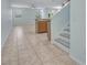 Open-concept living area with tile flooring and staircase at 3530 Rodrick Cir, Orlando, FL 32824