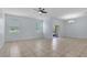 Bright living room with tiled floors, ceiling fan, and sliding glass doors to outdoor area at 3530 Rodrick Cir, Orlando, FL 32824