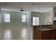 Living area open to kitchen with granite counters and stainless appliances at 3530 Rodrick Cir, Orlando, FL 32824
