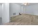 An open loft area features neutral walls and wood-look floors at 3530 Rodrick Cir, Orlando, FL 32824