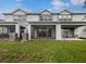 Spacious screened-in lanai with an outdoor seating area and lush green lawn at 3737 Plainview Dr, Orlando, FL 32824