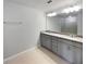 Well-lit bathroom featuring a double vanity with granite countertops and a large mirror at 3737 Plainview Dr, Orlando, FL 32824
