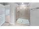 Modern bathroom featuring a glass-enclosed shower with sleek fixtures and neutral tile at 3737 Plainview Dr, Orlando, FL 32824
