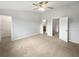 Bright and spacious bedroom with neutral carpet and a ceiling fan for added comfort at 3737 Plainview Dr, Orlando, FL 32824