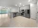Spacious kitchen with stainless steel appliances and an open view of the living area at 3737 Plainview Dr, Orlando, FL 32824