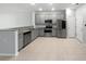 Modern kitchen with stainless steel appliances, granite countertops, and ample cabinet space at 3737 Plainview Dr, Orlando, FL 32824