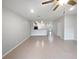 Spacious open-concept living room with tile flooring, seamlessly connecting to the kitchen area at 3737 Plainview Dr, Orlando, FL 32824