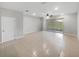 Spacious open-plan living room with tile flooring, recessed lighting, and access to the outdoor patio at 3737 Plainview Dr, Orlando, FL 32824