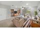 Bright living room featuring neutral-toned furniture, striped rug, and sliding glass doors to the outdoors at 3737 Plainview Dr, Orlando, FL 32824