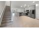 Open-concept living space with tile floors and stainless steel appliances in the kitchen at 3737 Plainview Dr, Orlando, FL 32824