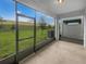 Screened patio offering views of a green lawn and scenic landscaping at 3737 Plainview Dr, Orlando, FL 32824