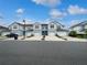 View of the townhome exteriors featuring a clean, well-maintained streetscape at 3737 Plainview Dr, Orlando, FL 32824