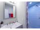 Clean bathroom featuring a vanity, mirror, and modern shower with glass door at 4515 Isaac Ln, Sanford, FL 32771