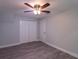 Comfortable bedroom featuring light gray walls, wood-look flooring, and ceiling fan at 4515 Isaac Ln, Sanford, FL 32771
