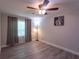 Bedroom with hardwood floors, neutral paint, a fan, and natural light at 4515 Isaac Ln, Sanford, FL 32771