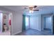 Bedroom features wood-look flooring, closet, and an attached bathroom at 4515 Isaac Ln, Sanford, FL 32771