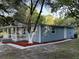 Home exterior showcasing a welcoming front porch, modern siding, and manicured landscaping at 4515 Isaac Ln, Sanford, FL 32771