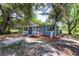 A cozy home is surrounded by lush greenery and a well-maintained landscape at 4515 Isaac Ln, Sanford, FL 32771